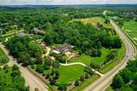 A bird's eye view of this unrivaled estate. Facing Concord Road, it sits on this premier corner lot with gated access on each side.