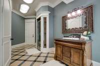 The ensuite bath in Bedroom 2 has a large walk-in closet, beautiful marble floors and a standup shower.