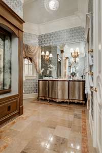 Separate vanities in the primary bathroom give extra space and storage with a polished look.