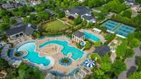 Drone view of 3 of the 4 pools.  On the left is the resort/family pool; on the right is the adult pool.  The tennis courts have become very popular with the pickle ball crowd.