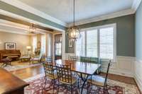 The front dining room has wainscoting & an updated light fixture. There are sand & finished hardwood floors throughout most of the main level. This room could serve another need since there is already ample seating in the kitchen & breakfast room.