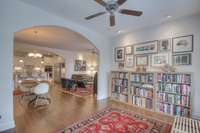 Sunroom with arched entry.