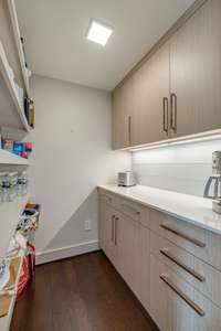 Adjacent to the kitchen is a well-designed 5x5 walk-in pantry - a great space for a coffee bar and small appliances.