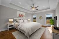 The primary bedroom has beautiful trey ceilings as well as a ceiling fan! The same flawless hardwoods continue into this bedroom! 9998 Big Springs Rd  Christiana, TN 37037 (virtually staged)