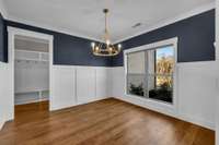 To the right of your front door, is this fabulous dining room space. Adorned with wainscotting and accented by a beautiful navy paint color, and a gorgeous light fixture. 9998 Big Springs Rd  Christiana, TN 37037