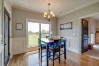 Breakfast nook/dining area with bedroom 2 on right