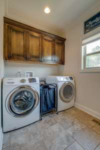 Tile flooring and extra space in the laundry area