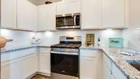 Pictures of furnished model. Finishes will vary. No subway tile back splash.