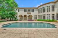 Pool has sitting areas on each side as well as fountain jets.