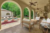 The covered patio is a great place for all seasons. The door next to the fireplace is the full pool bath.