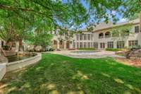 The generous 1.23 acre lot allows for a nice green space in addition to the expansive entertaining area around the pool