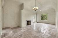 Upstairs sitting area with a gas fireplace. Look at the custom curved walls that give this home character.