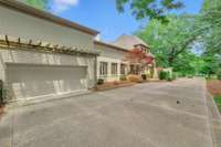 2 car garage on the left side has an entrance into the primary