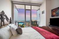 From the bedroom, enjoy views of downtown day or night