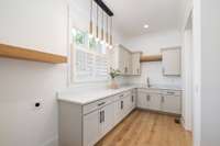 This thoughtfully placed laundry room on the main floor streamlines household chores and makes laundry day a breeze.