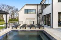 Space for four to lounge by the jacuzzi at the home while you grill out for lunch directly off the kitchen.