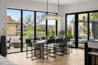 Spacious dining area with beautiful Restoration Hardware designer light fixture