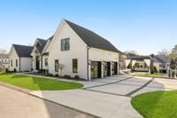 Access your three car garage through your custom concrete slab design driveway