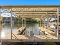Enjoy your community dock with a private boat slip and waverunner lift (space for a second).