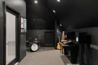 This spacious flex space offers endless possibilities for a music studio for all of your creative endeavors.