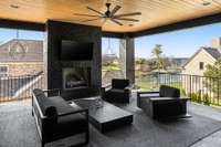 Outdoor porch has gas fireplace ready for cool nights by the fire while you watch the sun set over the lake!