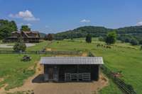 The two-stall barn with a tack/feed room with solar lighting