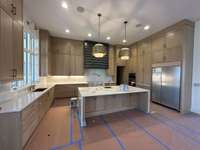 Stunning Gourmet Kitchen with-in Pantry overlooking Dining Room and Great Room  Built By: Insignia Homes  *this home is under construction Photo taken 2/23/24