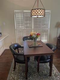 Breakfast nook with large windows and REAL hardwood floor.