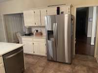 This wonderful refridgerator stays.  Silestone countertops and backsplash are new. Lots of counter space.