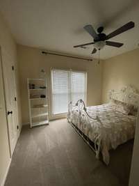 Bedroom #2 looks out on the magnolia tree.  Large walk in closet. Ceiling fan with remote control.