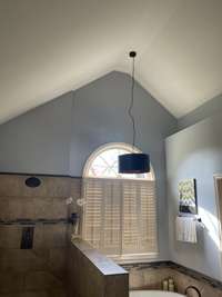 Cathedral ceiling and plant ledge in master batch  Note the beautiful window that looks out on the backyard.