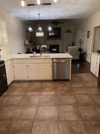 Ceramic tile floor in kitchen.  Room for an island if you want one!  Motion detectors for the security system are installed in the kitchen and livingroom.