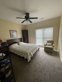 Bedroom #3 also has a walk in closet, remote control ceiling fan, and large windows looking out over the magnolia tree.