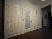 Master bedroom windows and door to the patio. Door has enclosed blinds.  Large walk in closet.