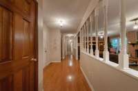 Looking down hallway and foyer from formal dining room.