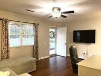 Living Room has hardwood flooring; Pella Vinyl Windows and Metal Roof;
