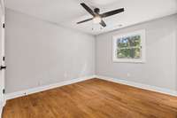 This bedroom offers a great window for natural light, a custom closet and private bath with walk-in shower.