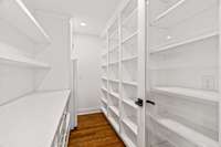 The large pantry offers great storage and includes an additional freezer and space to tuck your microwave.