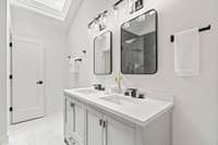 The bathroom features double vanities and a separate water closet.