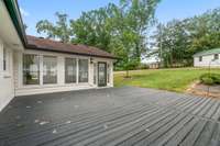 The large deck off the sunroom is perfect for an outdoor entertainment space.