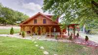 cozy cabin with wrap around porch