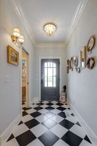 This whimsical foyer welcomes you in to your fabulous new home!