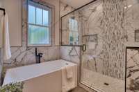 Huge Tiled shower with Double shower heads plus a soaking tub!