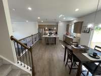 View from the Primary Suite hallway looking back into the Dining space & Kitchen... and  don't forget the Walk-In Pantry