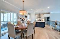 View from the Primary Suite Hallway looking into the Dining Area into a Gorgeous Kitchen!