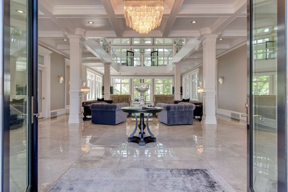 As you enter through the double glass doors into this majestic home, there's no mistaking you've enter a world of pure luxury and uniqueness.