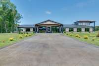 Toward the front of the property near the entrance is the guest/office house.