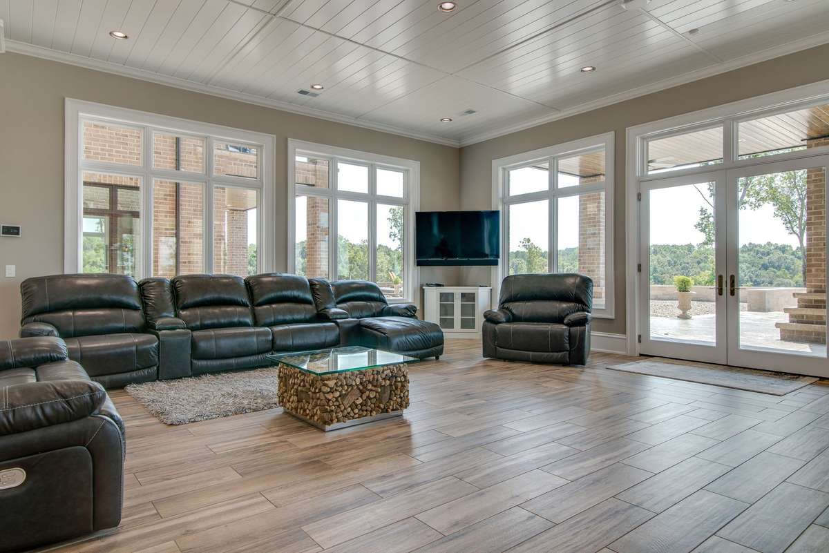This lounge area is situated between the home theater and the expansive outdoor patio.