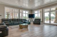 This lounge area is situated between the home theater and the expansive outdoor patio.