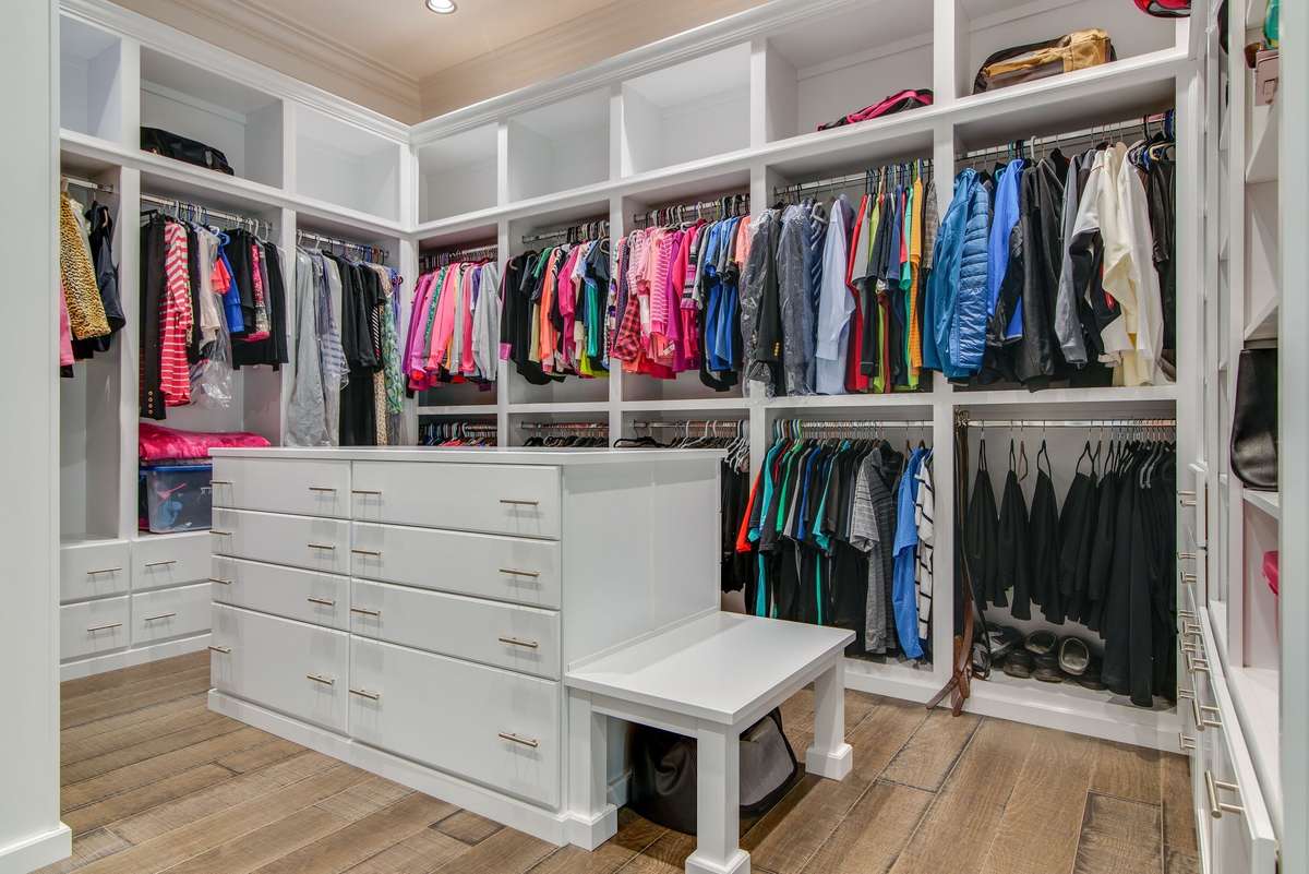 The incredible woodwork details throughout the home even carries into the room-sized closet.
